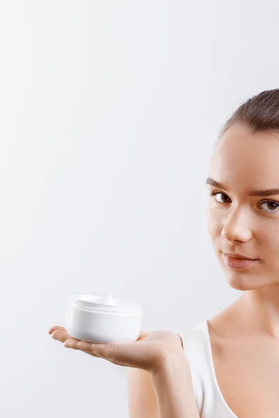 Beauty Concept Woman Holds Cream Her Hand Spreads Her Face — Stock Photo, Image