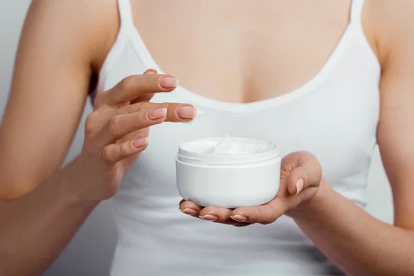 Hand Skin Care. Close Up Of Female Hands Holding Cream Tube, Woman Hands With Natural Manicure Nails Applying Cosmetic Hand Cream On Soft Silky Healthy Skin. Beauty And Body Care Concept