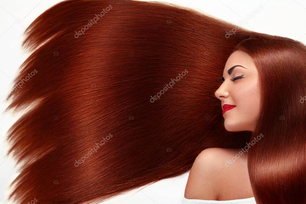 Beautiful Hair. Beauty woman with luxurious long hair as background. Beauty Model Girl with Healthy red Hair. Pretty female with long smooth shiny straight hair. Hairstyle. Keratin straightening.