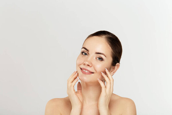 Healthy skin brunette woman closeup face clean healthy skin eyes and lips isolated on white