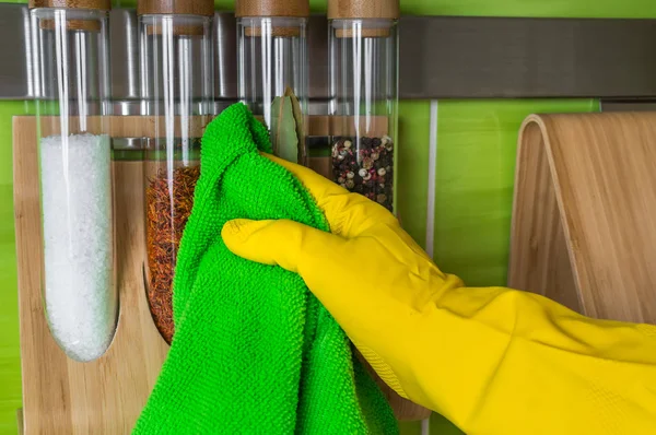 Hand Glove Green Rag Wiping Spice Bottles Housework Housekeeping Concept — Stock Photo, Image