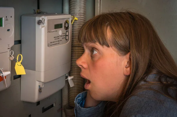 Terrified Woman Checking Electricity Meter Consumption Expensive Electricity Concept — Stock Photo, Image