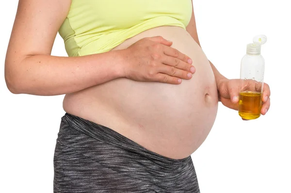 Kobieta Ciąży Jest Zastosowanie Nawilżający Olejek Ciała Brzuchu — Zdjęcie stockowe