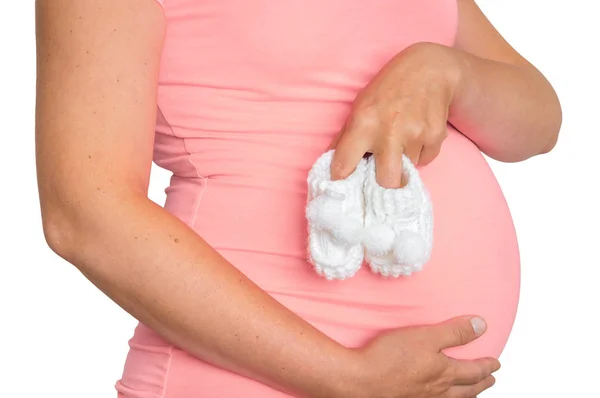 Hamile Kadın Küçük Beyaz Arka Plan Üzerinde Izole Bebek Patiği — Stok fotoğraf