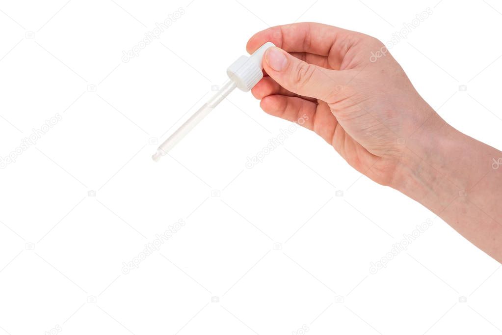 Hand of woman is holding pipette with liquid - isolated on white background