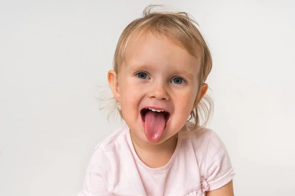 Little Baby Girl Showing Tongue Isolated Background — Stock Photo, Image