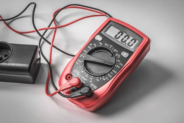 Measurement of voltage in electrical socket - digital multimeter