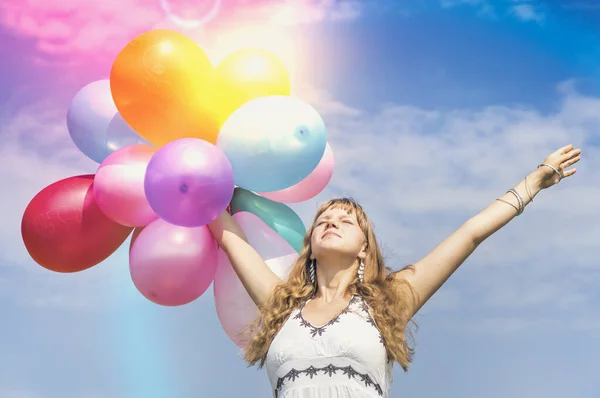 Happy young lady celebrates birthday with balloons — Stock Photo, Image