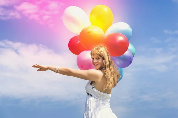 Happy young lady celebrates birthday with balloons — Stock Photo, Image