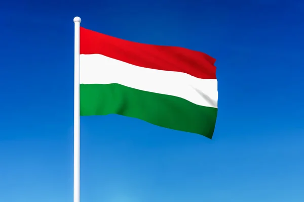 Waving flag of Hungary on the blue sky background — Stock Photo, Image