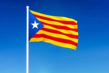 Catalonia dalgalanan bayrak mavi gökyüzü arka plan üzerinde