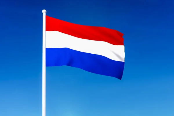 Flagge der Niederlande auf blauem Himmel — Stockfoto