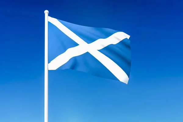 Waving flag of Scotland on the blue sky background — Stock Photo, Image