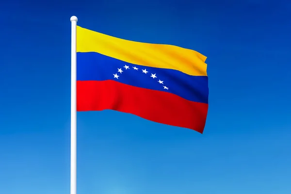 Bandeira acenando da Venezuela no fundo do céu azul — Fotografia de Stock