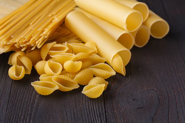 Dried Mixed Pasta Dark Wooden Table Top View Copy Space — Stock Photo, Image