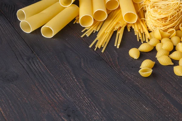 Dried Mixed Pasta Dark Wooden Table Top View Copy Space — Stock Photo, Image