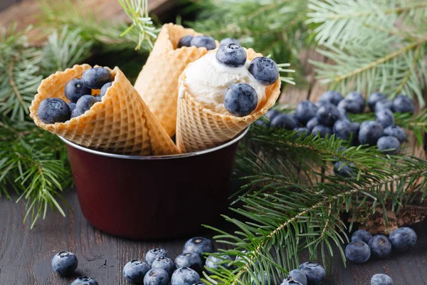 Melted ice cream in a bucket of blueberry.