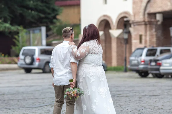 Wedding scenes with fat bride and groom at the wedding walk