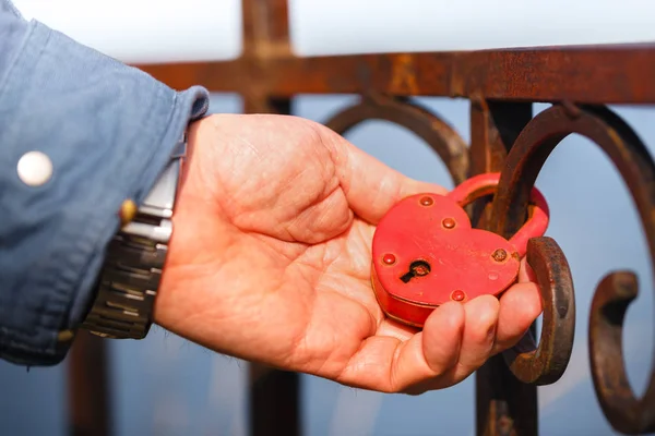 Love the lock and keys, concept of love and fidelity, Newlyweds hang the lock symbol everlasting love at the bridge, Valentine\'s day, Wedding tradition.