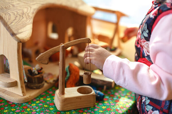 Little autistic boy playing with toy outdoor