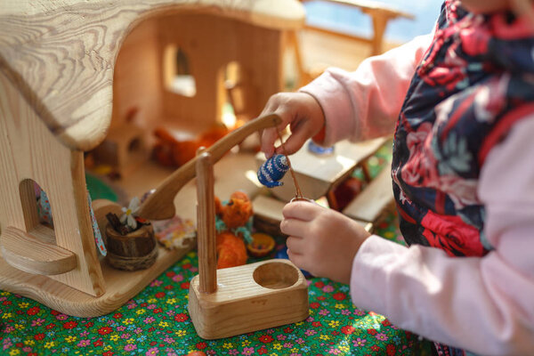 Autistic kid play alone with train toys