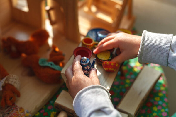 Concentrated boy puts colorful coins during ABA