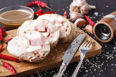 Roulade of stuffed chicken clipart
