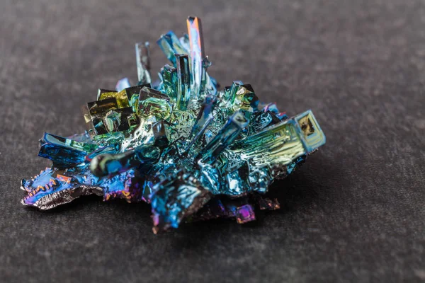 Bismuth crystals on a dark background. This is the most strongly — Stock Photo, Image