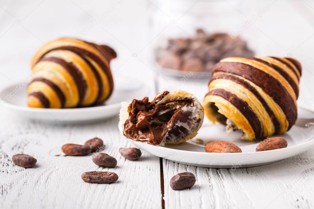 Croissants with chocolate filling cup and fresh morning coffee