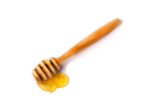 Honey stick with flowing honey isolated on white background — Stock Photo, Image