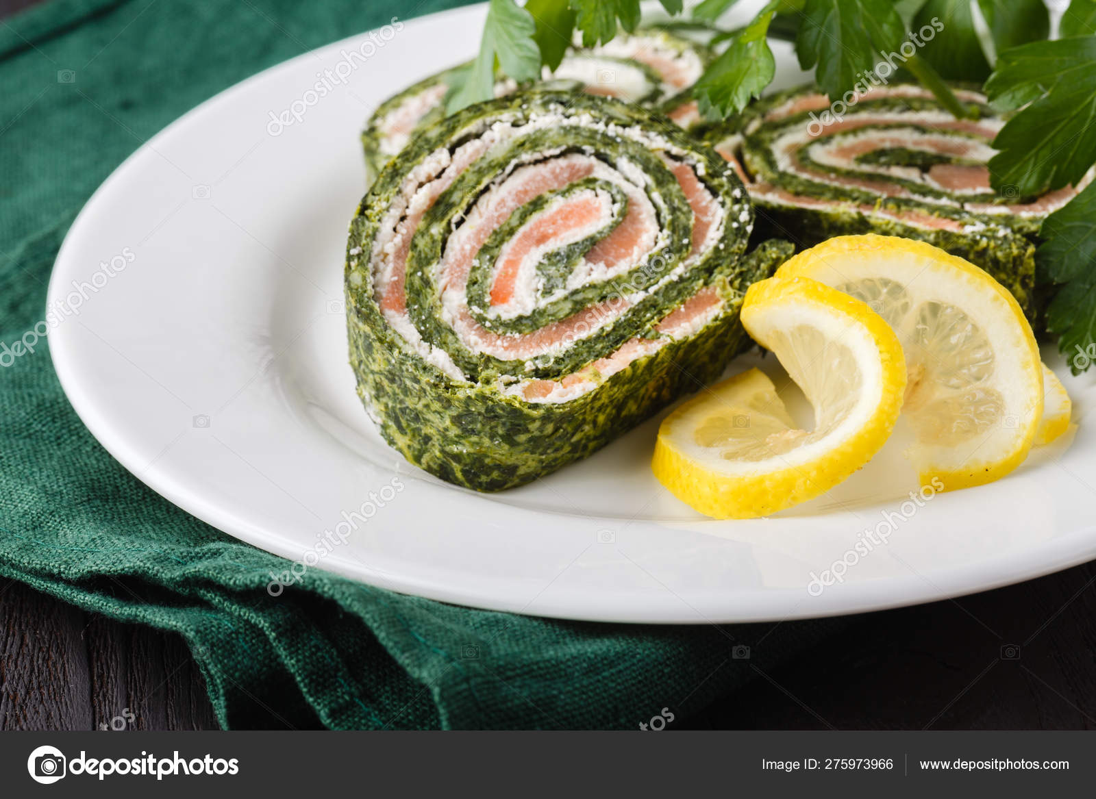Roll salted salmon, cream cheese and spinach Stock Photo by