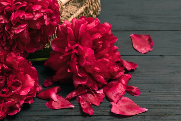 Bouquet of peonies, beautiful peonies on an old wooden backgroun