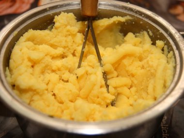 Mashed potatoes in a saucepan. clipart