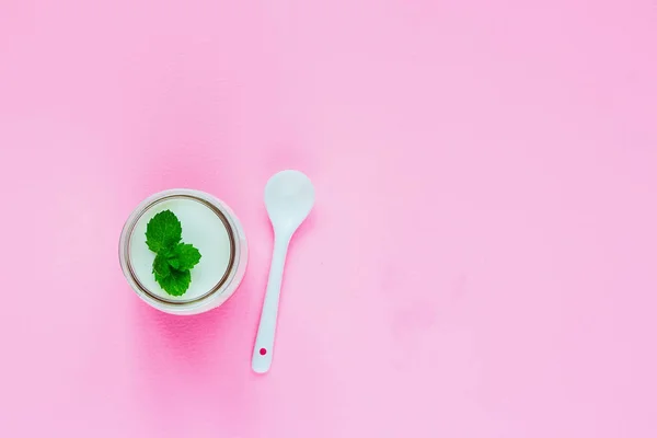 Breakfast. Greek yogurt on pink background. Clean eating, vegetarian, weight loss, fitness nutrition concept. Flat lay, top view