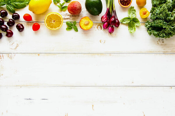 Flat lay of seasonal fruit, vegetables and greens. Summer food concept. Healthy life and vegetarian, vegan, dieting, clean eating ingredients