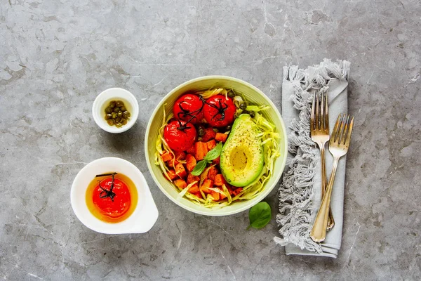 Flat lay of vegan dinner bowl. Fresh salad, avocado half, grains, beans, roasted vegetables, top view. Superfood, clean eating, dieting food concept - Image