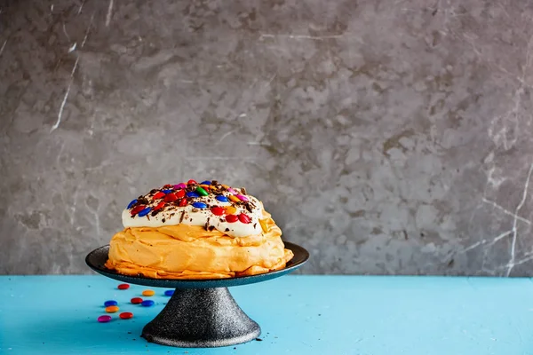 Pavlova cake with colorful Sprinkles