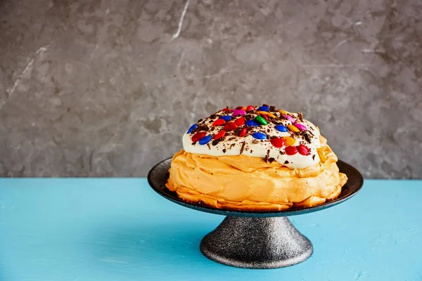 Pavlova cake with colorful Sprinkles