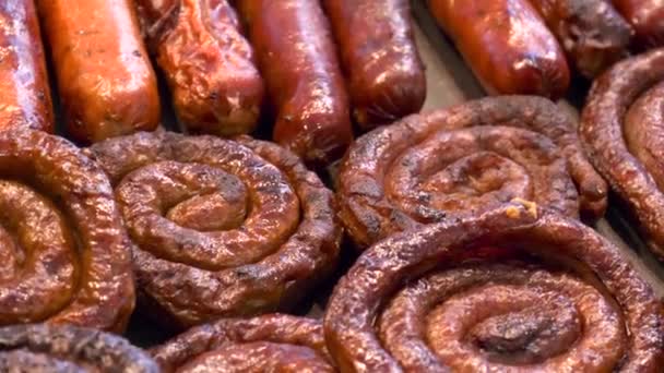 Grilling sausages on barbecue grill. — Stock Video