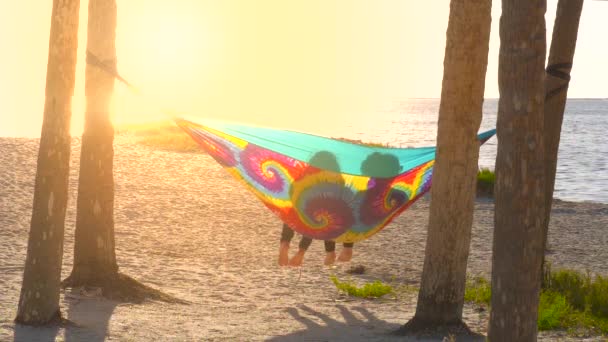 Romantic Lesbian Couple Relaxing Rainbow Colors Hammock Sunset Happy Lesbians — Stock Video