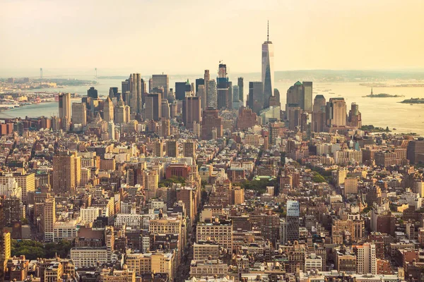 View of Manhattan from the top angle at sunset. New York City view from the top. New York City with skyscrapers at sunset. Skyline of Manhattan in New York City, United States. Aerial view of New York