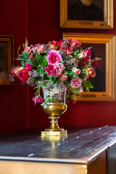 Vase flowers in the interior of an ancient palace