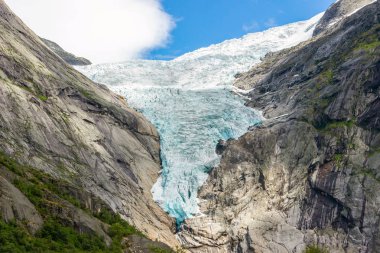 Briksdalsbreen glacier with melting blue ice clipart