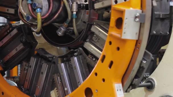 Tire manufacture robotic machine close up — Stock Video