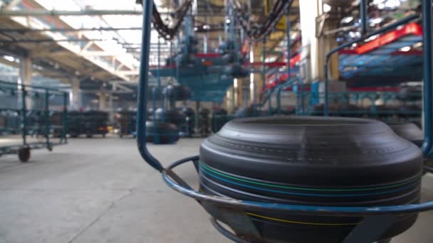 Tire moves on the conveyor at factory. — Stock Video