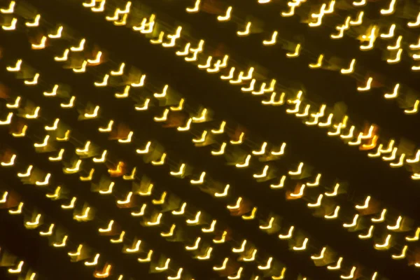 Soyut xmas altın pırıltılar veya parlak ışıklar. Noel şenlikli altın arka plan. Ufuk bokeh parçacıklar. Tasarım şablonu