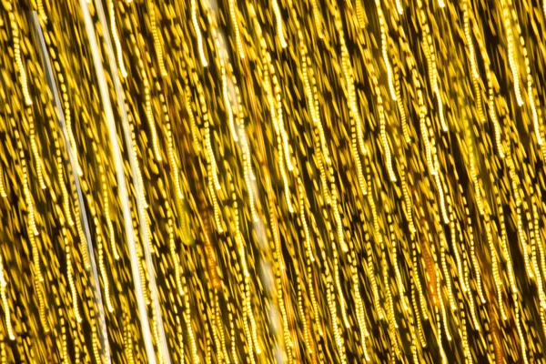 Soyut xmas altın pırıltılar veya parlak ışıklar. Noel şenlikli altın arka plan. Ufuk bokeh parçacıklar. Tasarım şablonu