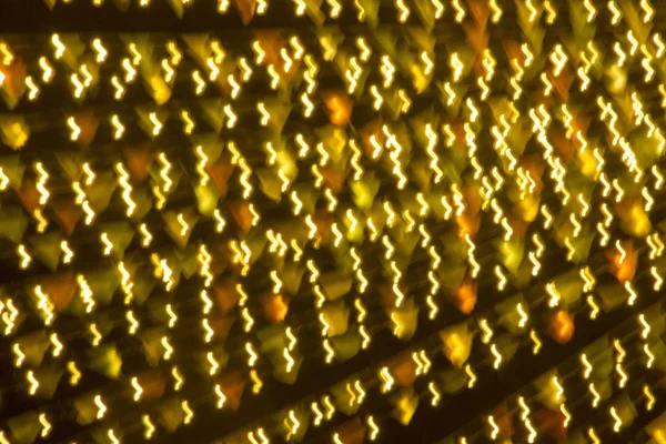 Soyut xmas altın pırıltılar veya parlak ışıklar. Noel şenlikli altın arka plan. Ufuk bokeh parçacıklar. Tasarım şablonu