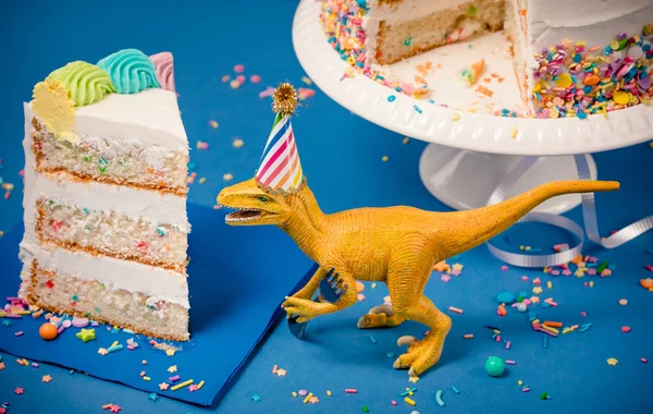 Dinosaur and slice of Birthday Cake