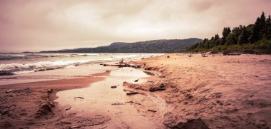 Beautiful toned beach puddles landscape at Neys Provincial Park, clipart